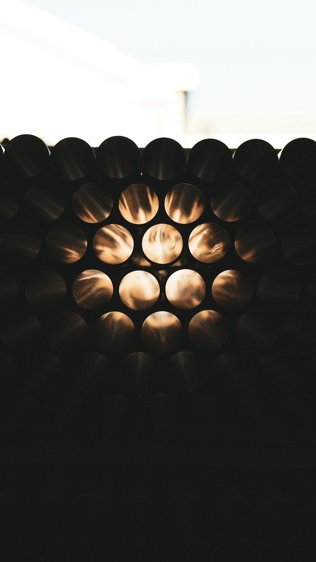 Circular objects arranged with light shining through them.