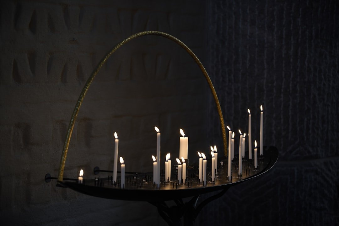 a tray with many lit candles on it