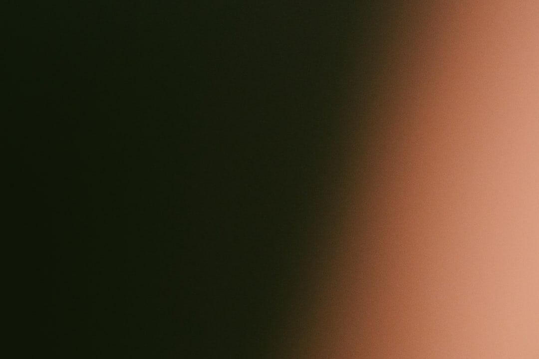 Dark green fading to light orange gradient