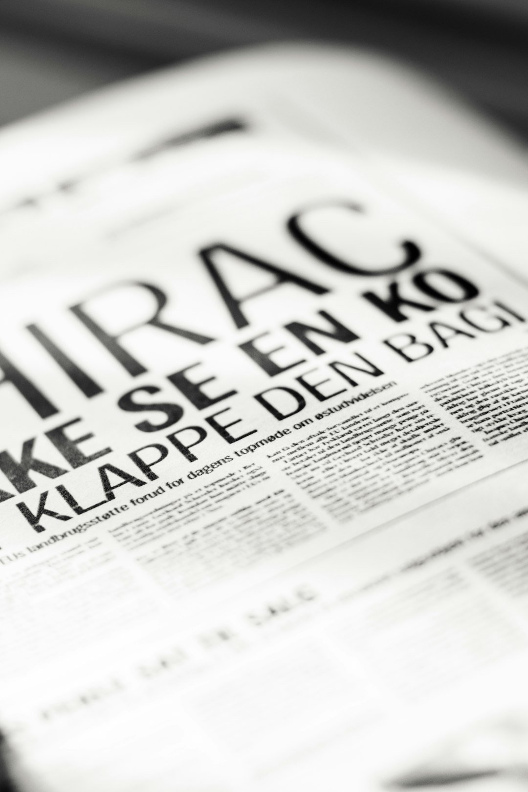 a close up of a newspaper with a black and white photo