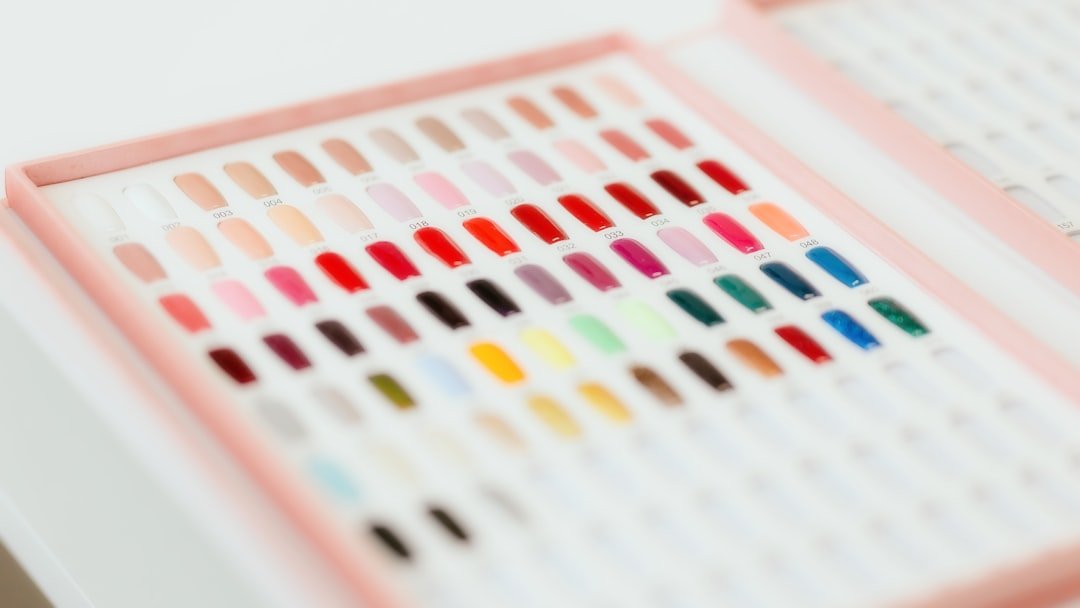 a close up of a box of colored crayons