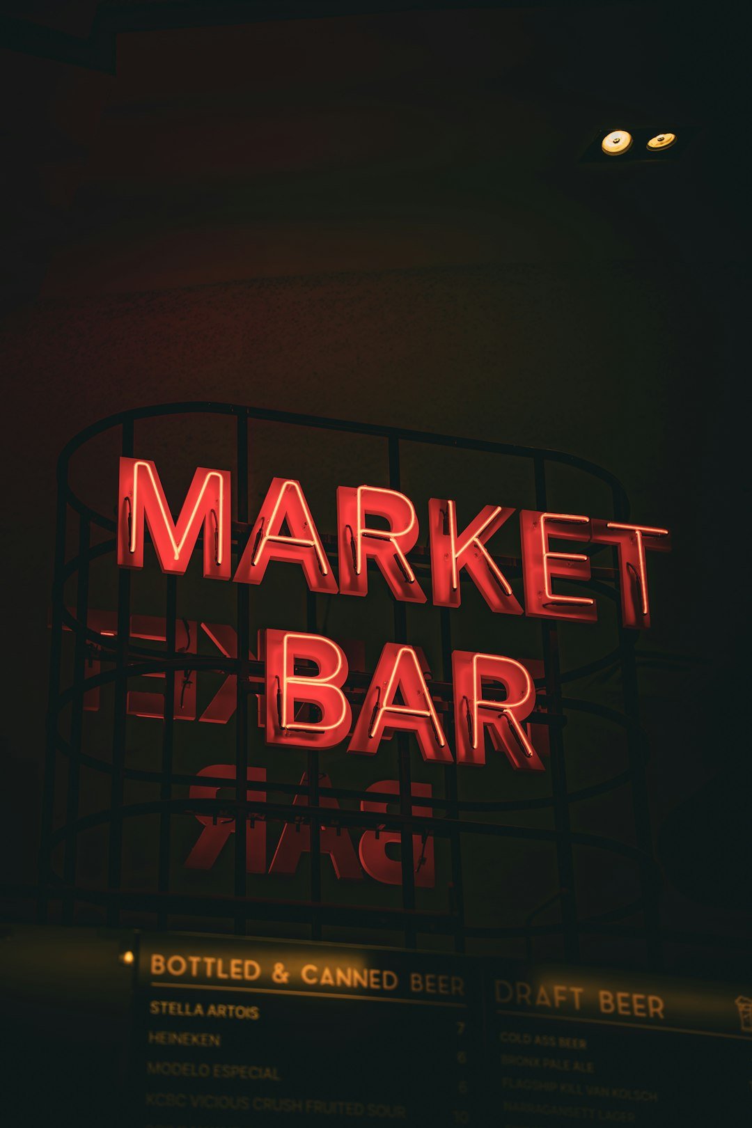 A neon sign that reads market bar