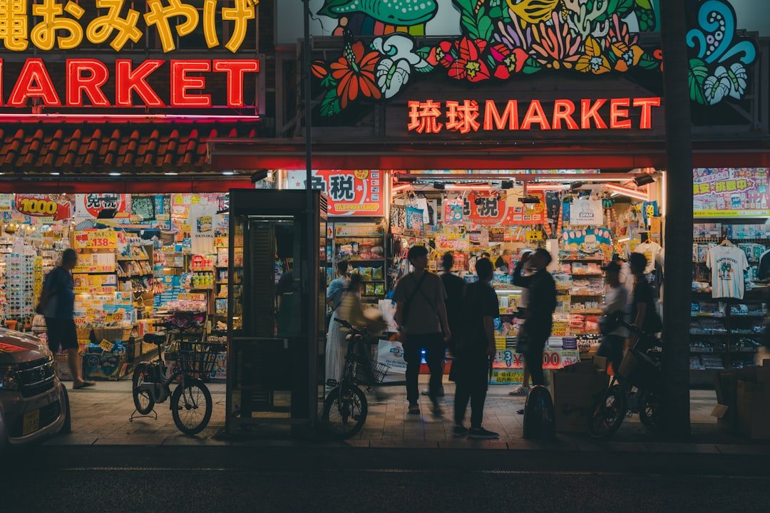 A group of people standing outside of a market