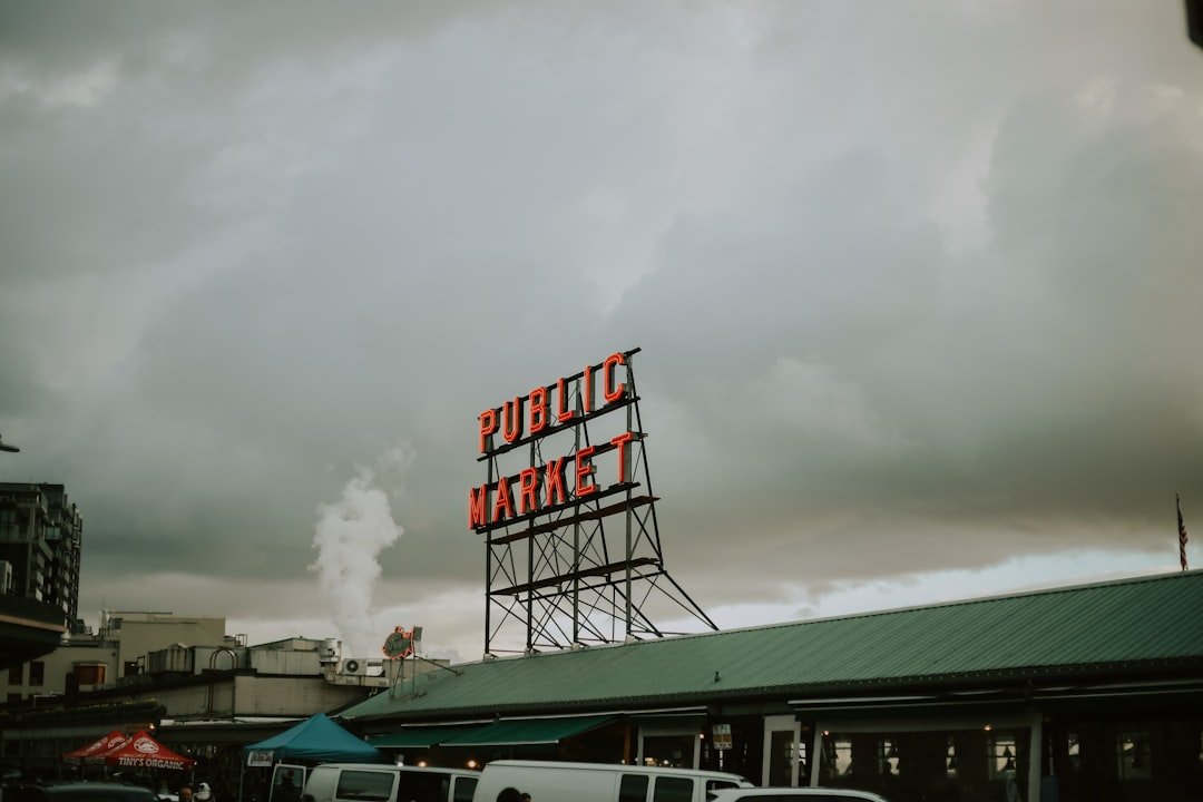 green and white boat on dock under white clouds during daytime