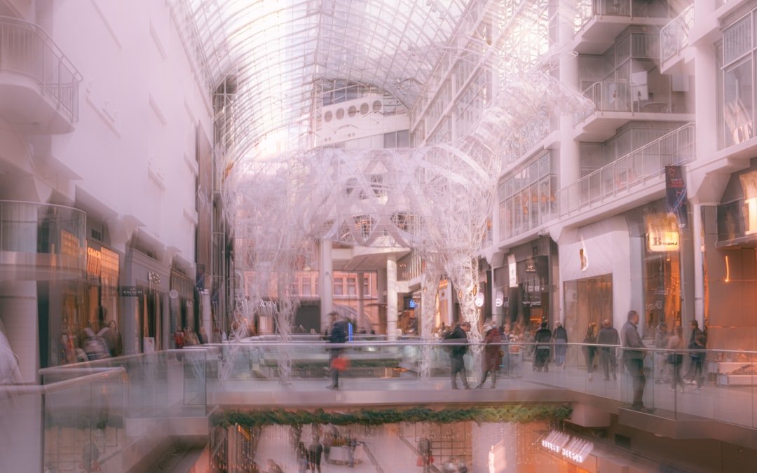 Blurred view of a busy indoor shopping mall atrium