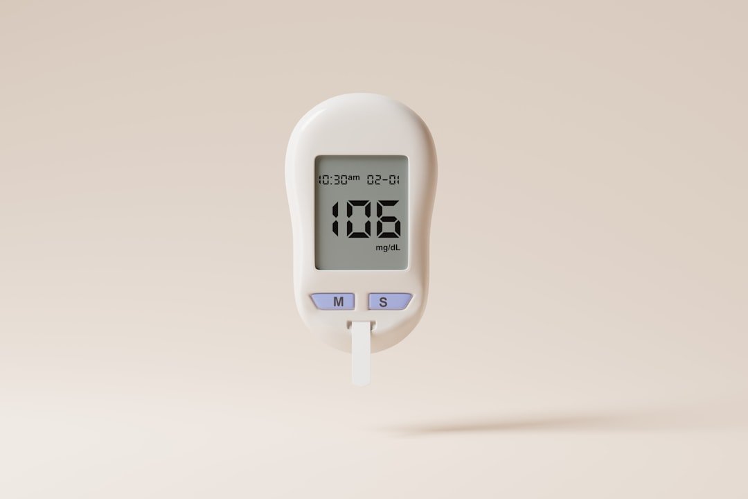 a digital thermometer on a beige background