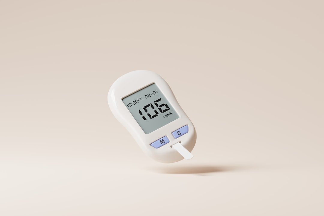 a digital thermometer on a beige background