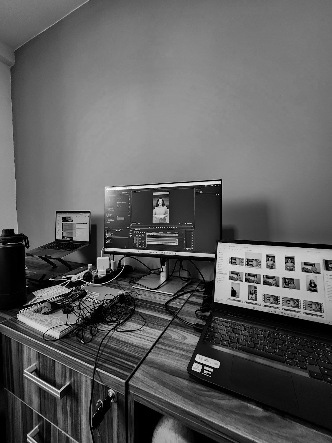 A desk with a laptop and a monitor on it