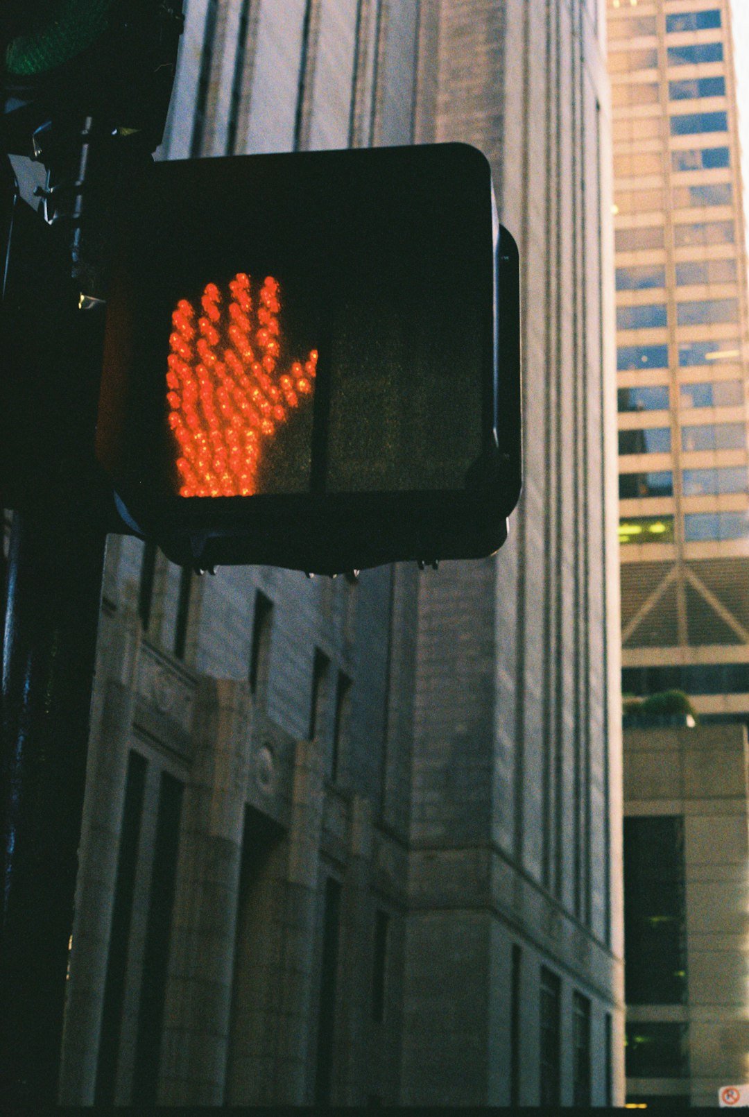 a traffic light with a hand print on it