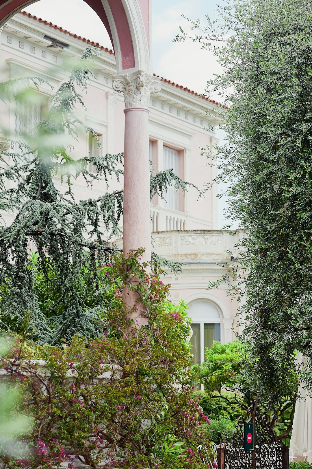 A bride and groom standing in front of a building